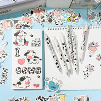 Xqumoi 67Pcs Cow Sticky Notes with Pen Stickers Stationary Set 0.5mm Black Gel Ballpoint Pens Milk Cow Self-Stick Notes Pads Cartoon Cow Shaped Vinyl Stickers School Office Supplies Party Favor Gift